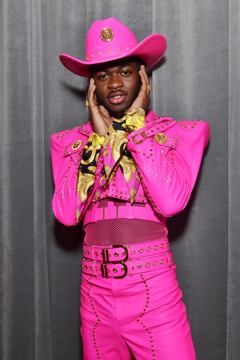 2025 Grammys Lil Nas X turns heads in a hotpink Versace outfit on the
