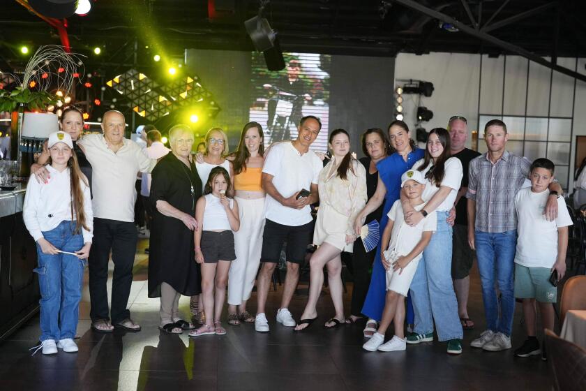 A July 2023 photo of s family gathering for a bar mitzvah has taken a very tragic turn. Two people in the photo were murdered, four who were kidnapped, the other family who ran away, their house was burned down, so they're homeless.