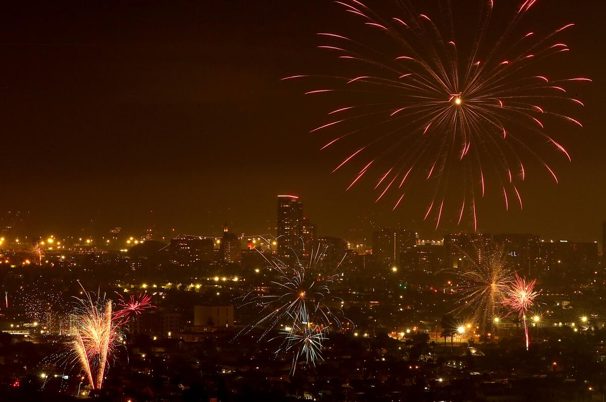 Illegal fireworks light up the night sky and leave a pall of smoke over Long Beach on Tuesday, July 4, 2023.