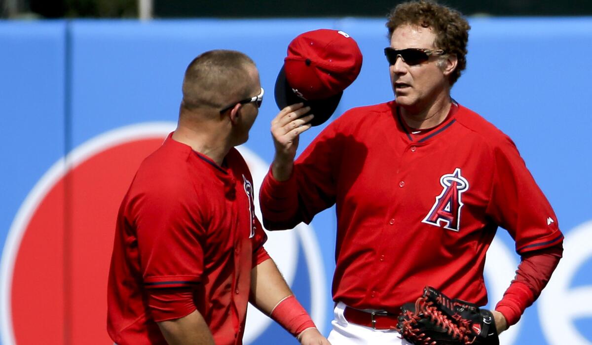 Actor Will Ferrell, right, replaces Angels center fielder Mike Trout during a spring training game against the Chicago Cubs on Thursday in Tempe, Ariz.