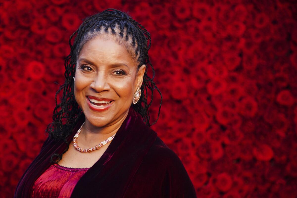 Phylicia Rashad poses for a photo on the red carpet 