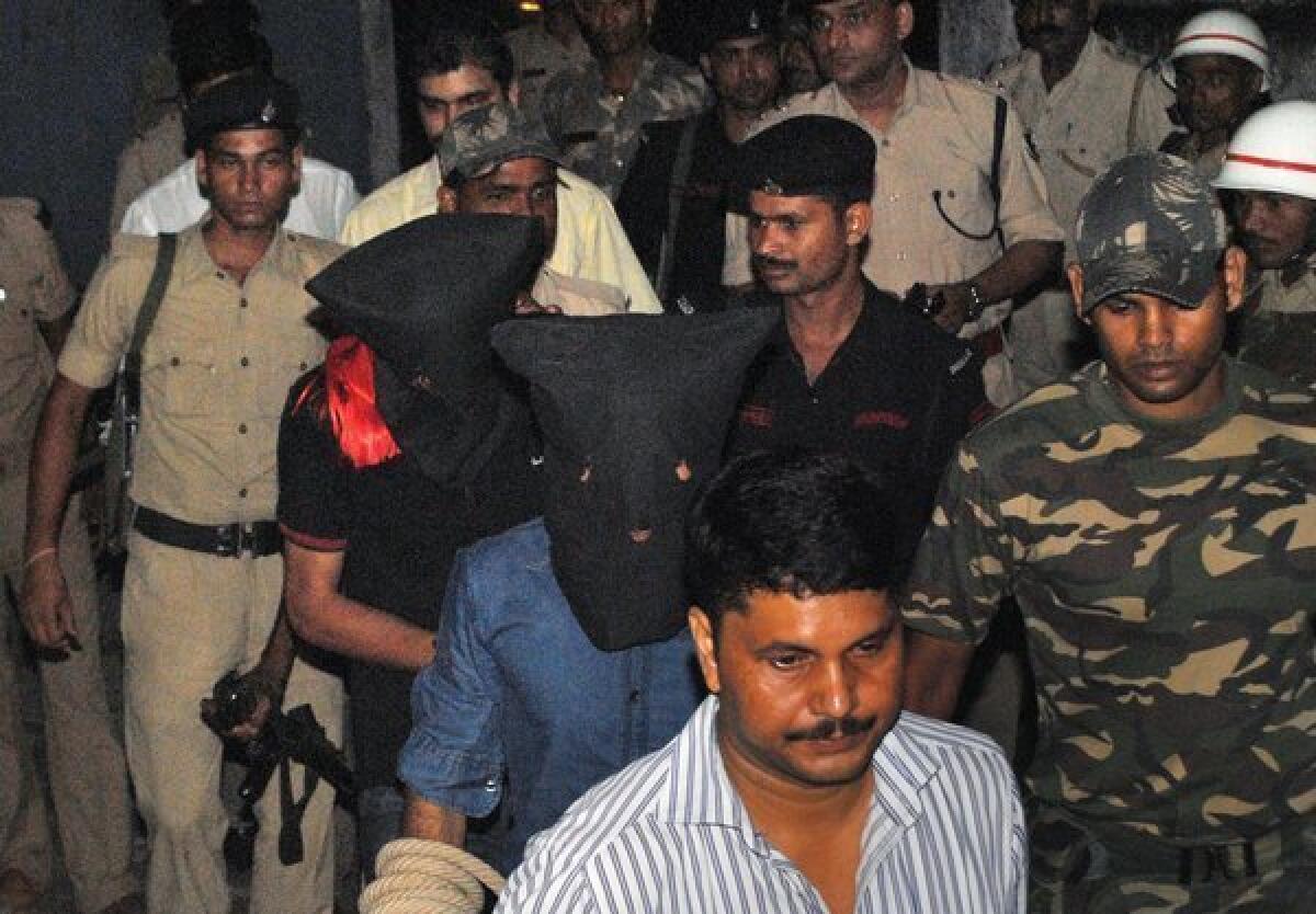 Two suspects in black hoods, including Yasin Bhatkal, an alleged founder of the militant group Indian Mujahedin, are taken to a court Thursday by police in Motihari, India.