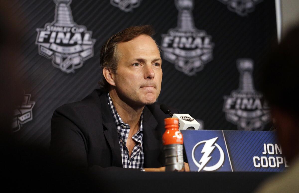 Tampa Bay Coach Jon Cooper listens at a news conference Sunday ahead of Game 6 of the Stanley Cup Final against the Chicago Blackhawks on Monday at the United Center.