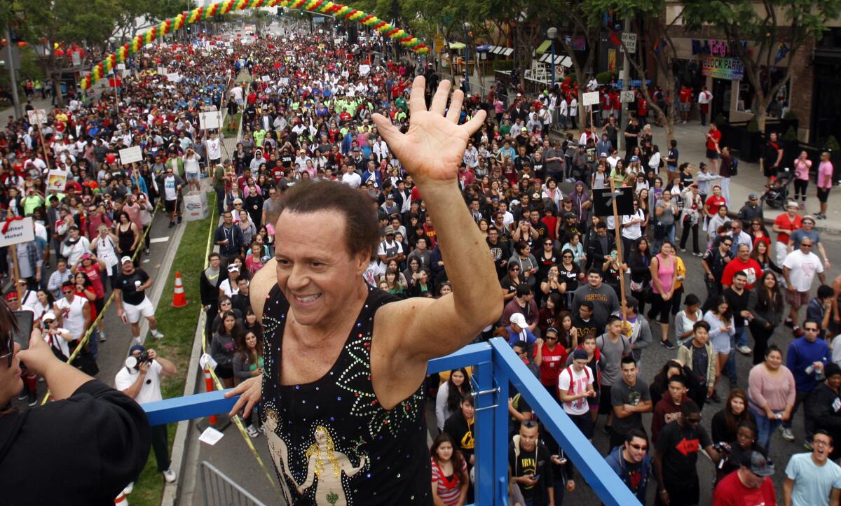 Richard Simmons waves to a crowd at AIDS Walk Los Angeles in 2013.