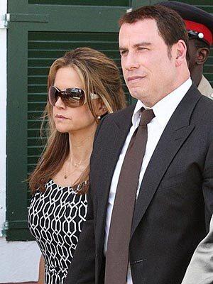 John Travolta and his wife, Kelly Preston, leave court in the Bahamas after Travolta's testimony against paramedic Tarino Lightbourne, who threatened to sell stories to the media suggesting the movie star was at fault in the death of his 16-year-old son, demanding $25 million.