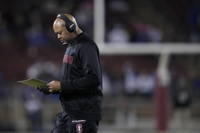 Stanford coach David Shaw stands near the sideline during a loss to BYU 