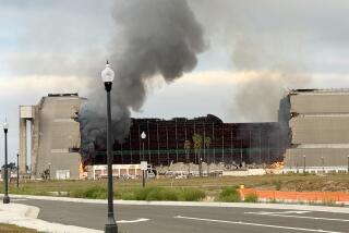 TUSTIN CA NOVEMBER 7, 2023 - A massive fire continues to burn the historic north blimp hangar in Tustin, an Orange County landmark that dates back to World War II on Tuesday morning, Nov. 7, 2023. (Irfan Khan / Los Angeles Times)