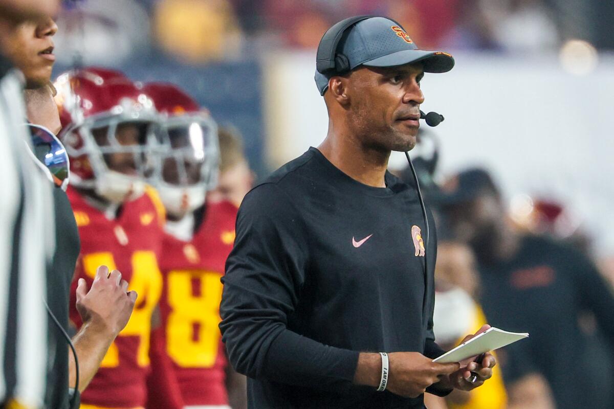 USC defensive coordinator D'Anton Lynn stands on the sideline during a win over LSU at Allegiant Stadium.