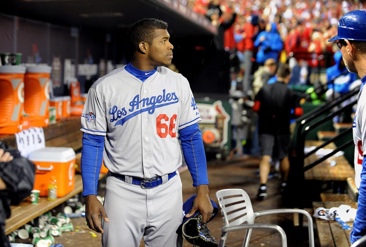 Dodgers rookie Yasiel Puig leaves the dugout after losing to the Cardinals in Game 6 of the NLCS on Friday.