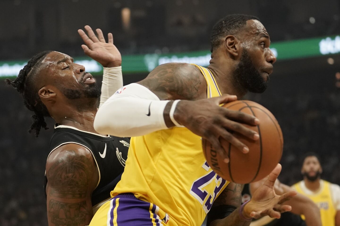 Lakers forward LeBron James drives past Bucks guard Wesley Matthews during the first half of a game Dec. 19.