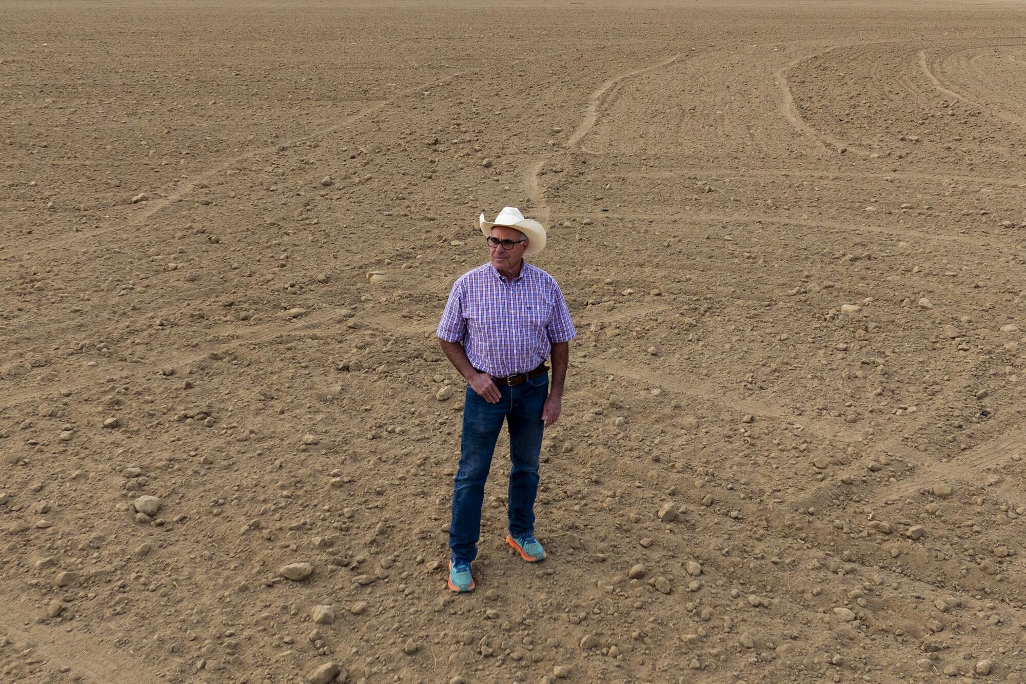Daniel Rudnick stands on land he owns in Buttonwillow, Calif.