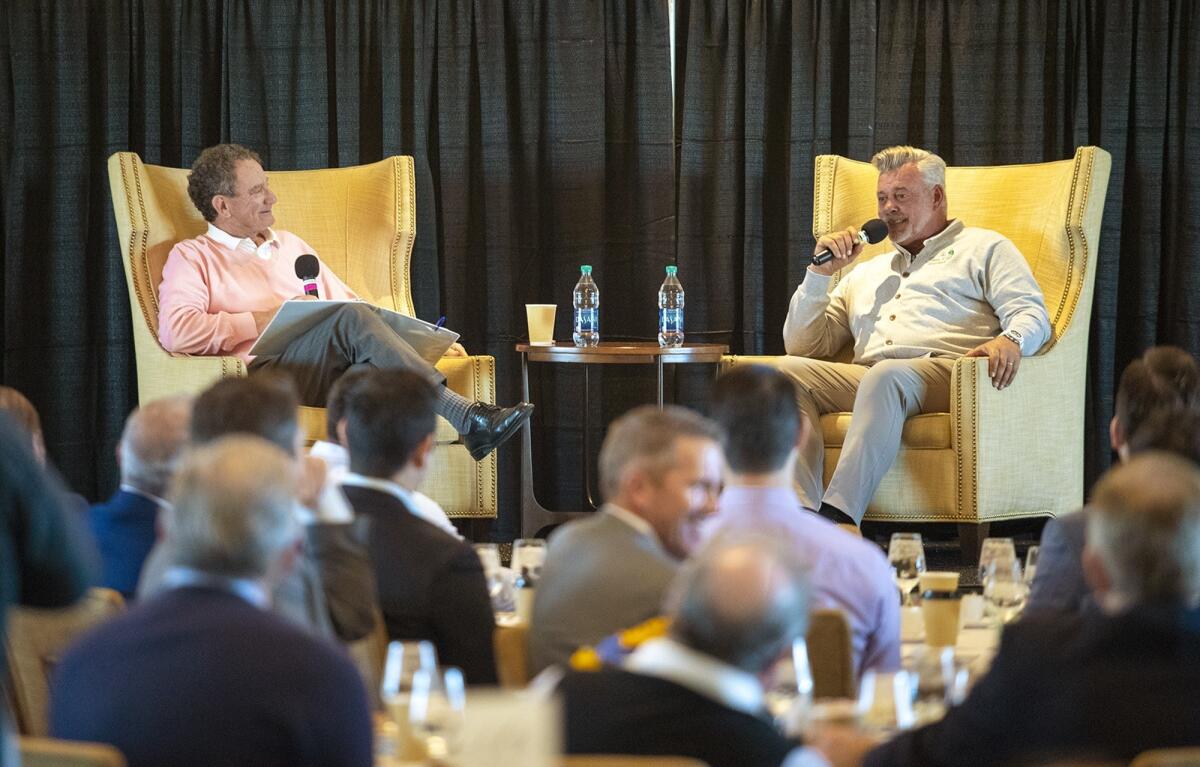 Hank Adler, left, interviews Darren Clarke during the Hoag Classic's Breakfast with a Champion at Newport Beach Country Club on Tuesday.