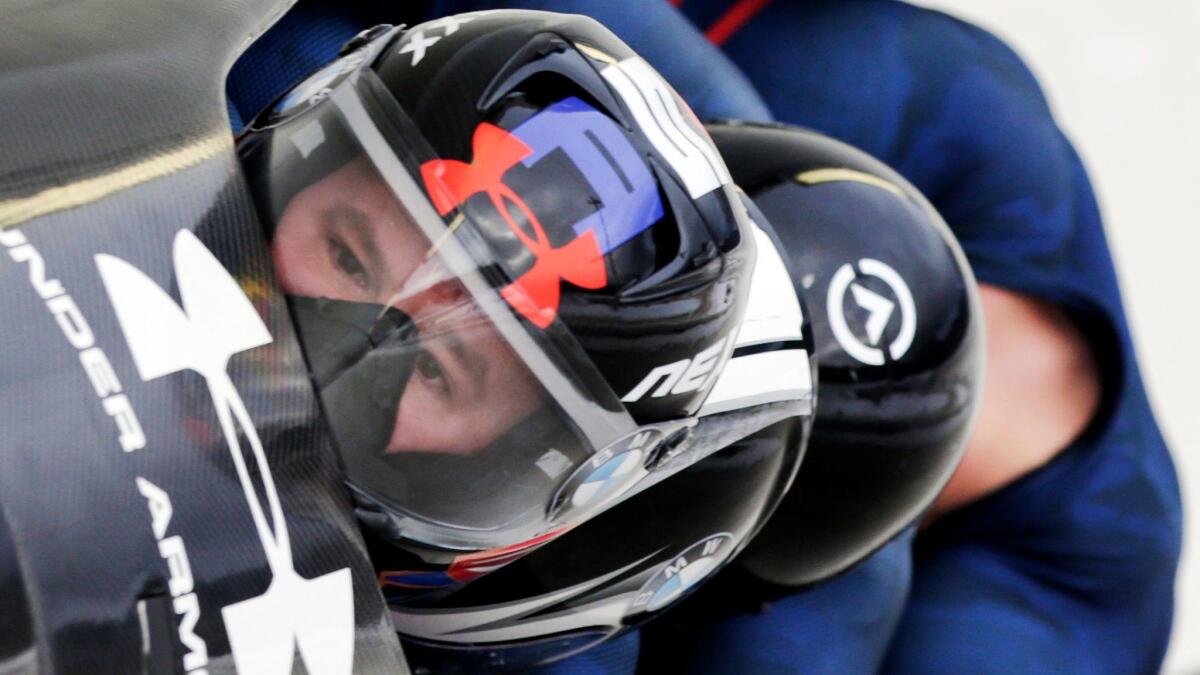 In this Jan. 9, 2016, file photo, driver Steven Holcomb with Frank Delduca, Carlo Valdes and brakeman Samuel McGuffie, compete in the four-man bobsled World Cup race in Lake Placid, N.Y.