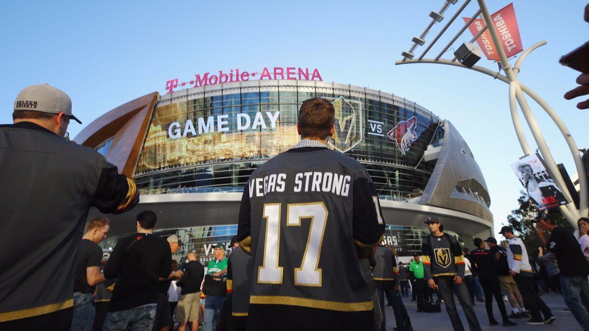 Fans arrive for the Golden Knights' inaugural regular-season home opener against the Arizona Coyotes at T-Mobile Arena on Tuesday in Las Vegas.