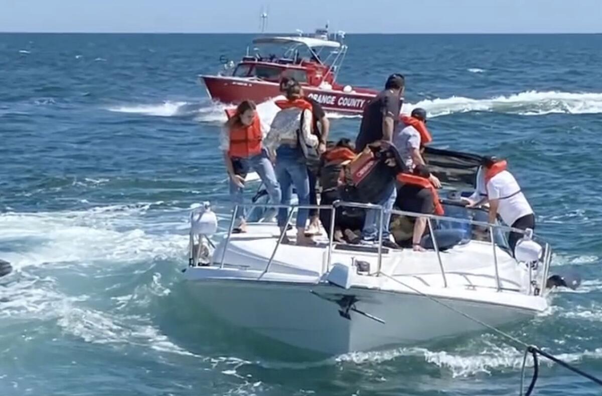 More than a dozen people await rescue on a sinking boat, a 41-foot Carver vessel.