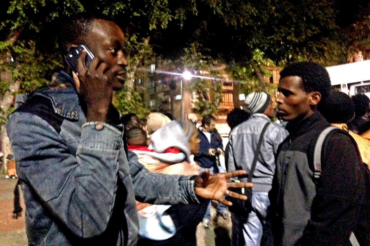 Mutasim Ali, left, seen during a recent protest in Tel Aviv's Lewinsky Park, is the public face of an estimated 55,000-strong African immigrant population that some in Israel wish would quietly disappear.