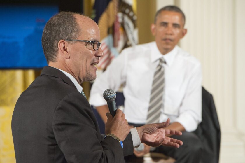 U.S. Secretary of Labor Thomas Perez, formerly the assistant attorney general for the Civil Rights Divison of the Justice Department, speaks as President Obama listens at the White House.