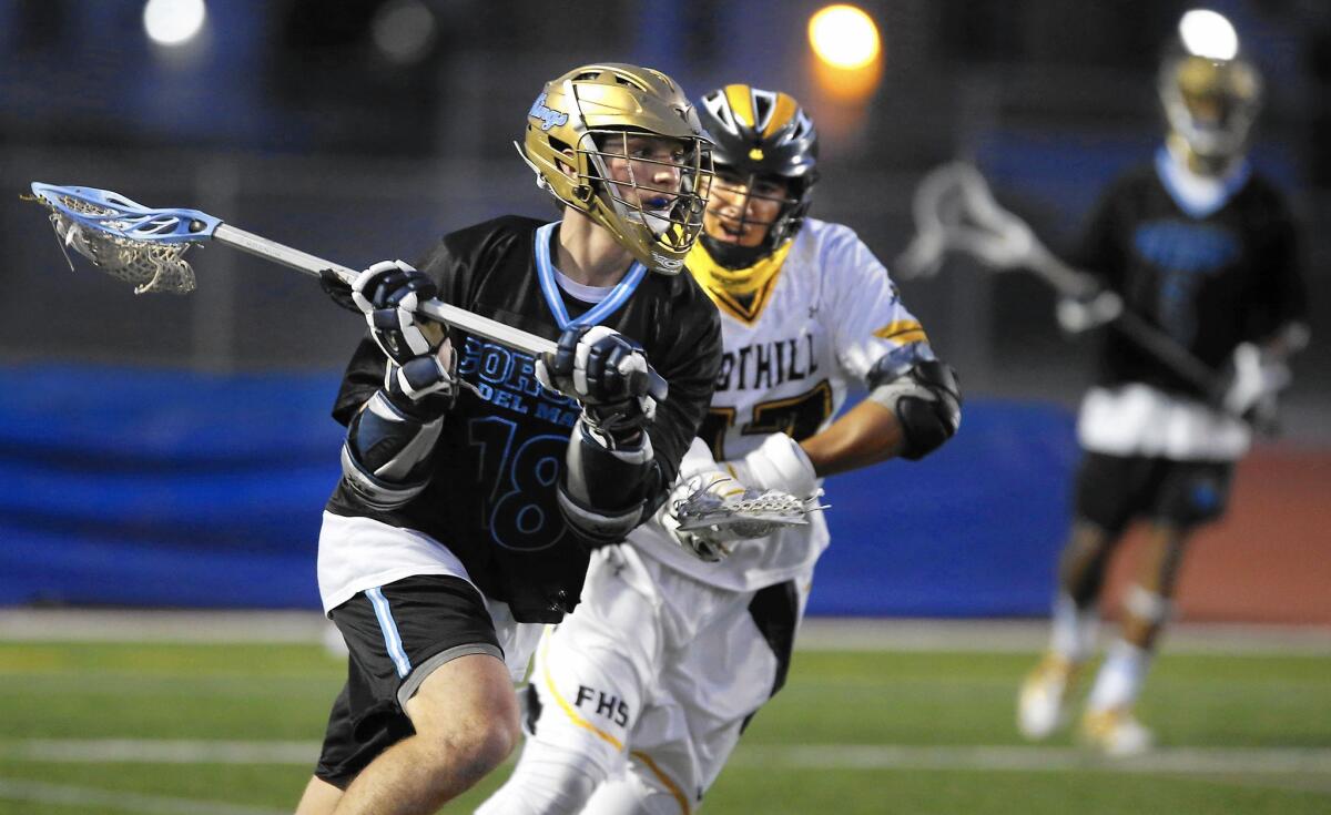 Corona del Mar's Jordan Greenhall looks to pass under pressure from Foothill's Jack Garcia.