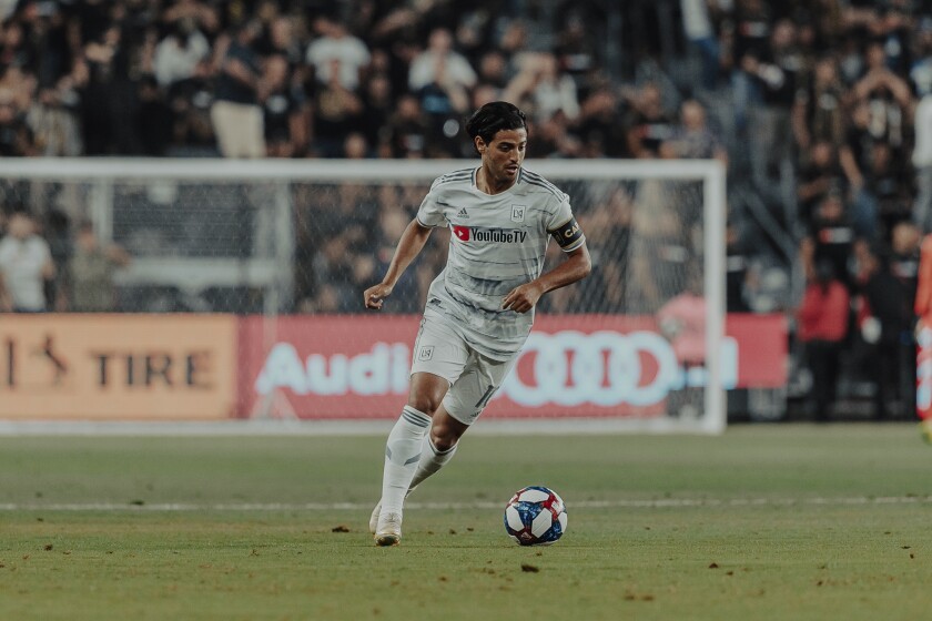 Carlos Vela controls the ball during a game.
