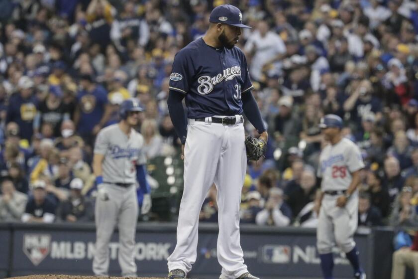 MILWAUKEE, WISCONSIN, SATURDAY, OCTOBER 13, 2018 - Brewers reliever Jeremy Jeffress pitches in the seventh inning of game two of the National League Championship Series at Miller Park. (Robert Gauthier/Los Angeles Times)