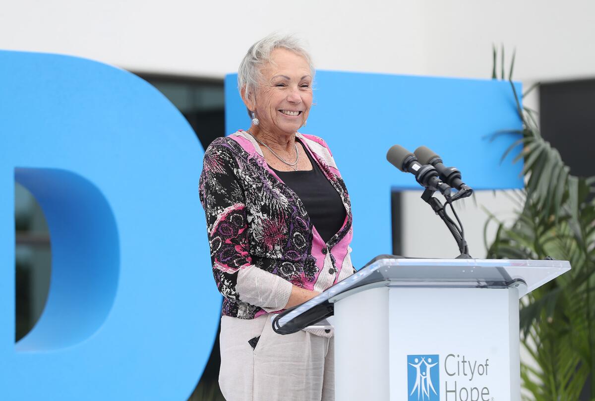 Cancer survivor Kathy Miller Willahan speaks during the ribbon-cutting ceremony for City of Hope Seacliff.