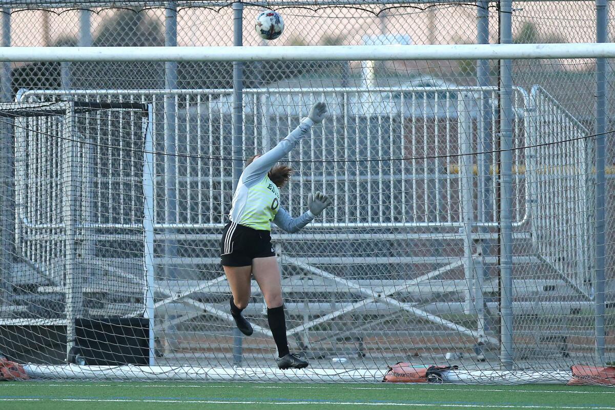 Edison goalkeeper Allyssa Plotkin makes a big save during a Surf League match against Corona del Mar on Thursday.