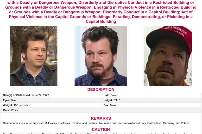 This wanted poster released by the FBI shows Evan Neumann, a former San Francisco Bay Area resident facing federal criminal charges from the Jan. 6 riot at the U.S. Capitol, who has been granted asylum in Belarus, the former Soviet nation's state media reported Tuesday, March 23, 2022. (FBI via AP)