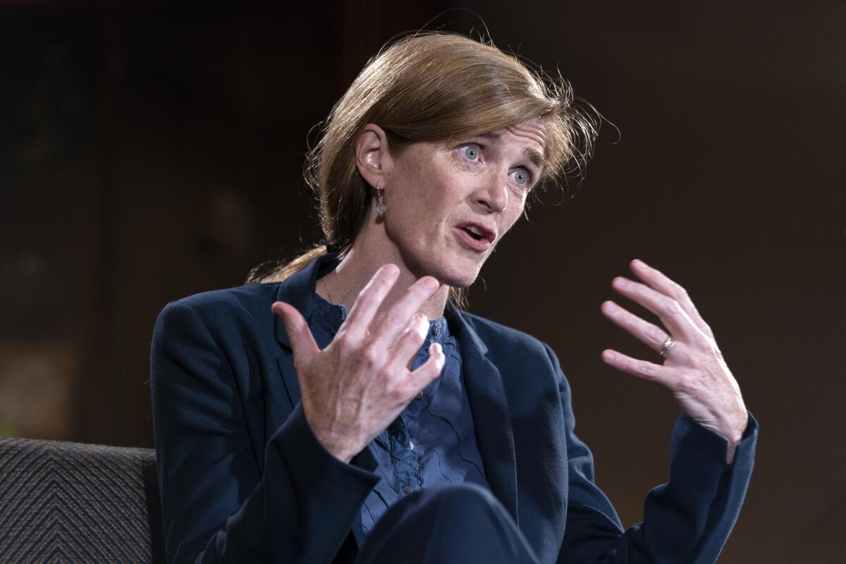 A woman gestures as she talks.