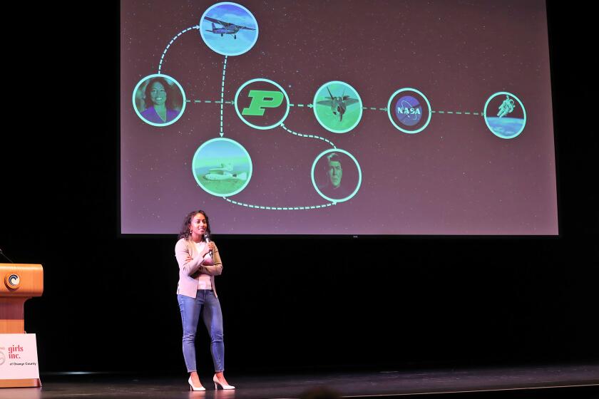 Keynote speaker Sirisha Bandla, an aeronautical engineer, commercial astronaut and Virgin Galactic leader, shows the audience her un-even carrer path as she speaks to 7 to 11-year-old girls at the IgniteHER Girls Summit at Orange Coast College on Friday.