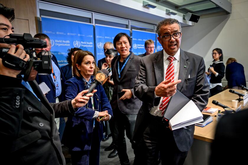 World Health Organization (WHO) Director-General Tedros Adhanom Ghebreyesus is surrounded by journalists at the end of a daily press briefing on COVID-19, the disease caused by the novel coronavirus, at the WHO heardquaters in Geneva on March 11, 2020. - WHO Director-General Tedros Adhanom Ghebreyesus announced on March 11, 2020 that the new coronavirus outbreak can now be characterised as a pandemic. (Photo by Fabrice COFFRINI / AFP) (Photo by FABRICE COFFRINI/AFP via Getty Images)