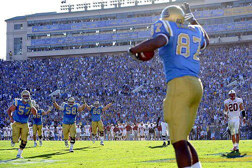 UCLA's Cory Harkey begins to celebrate, along with his teammates, after making the winning touchdown catch with 10 seconds left against Stanford on Saturday.