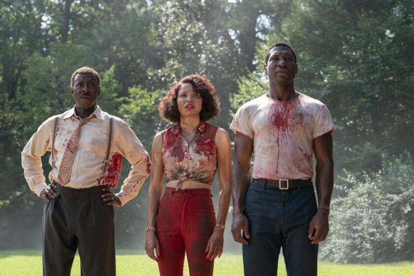 This image released by HBO shows, from left, Courtney B. Vance, Jurnee Smollett and Jonathan Majors in a scene from "Lovecraft Country." The program was nominated for an Emmy Award for outstanding drama series. (HBO via AP)