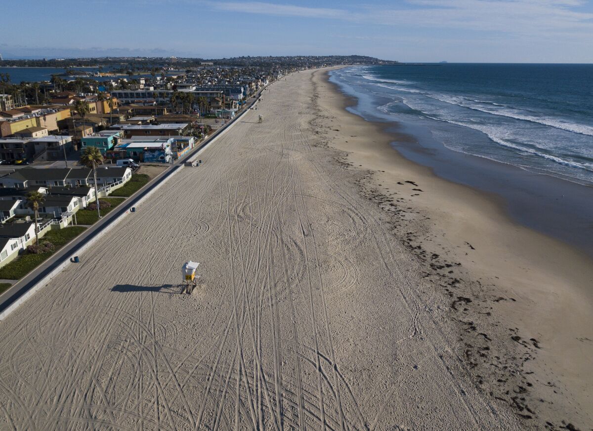 An empty Pacific Beach on March 24, 2020. San Diego city beaches, parks and trails were closed to slow down the spread of the coronavirus. Tax revenue lost because of shutdown orders has San Diego facing a $250 million budget gap.