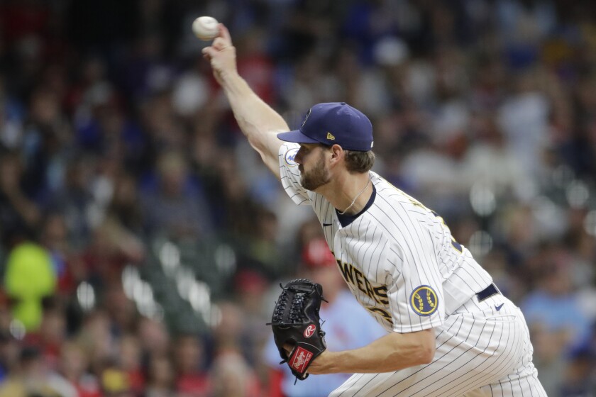 Milwaukee Brewers' Adrian Houser pitches during the first inning of a baseball game against the St. Louis Cardinals, Saturday, Sept. 4, 2021, in Milwaukee. (AP Photo/Aaron Gash)