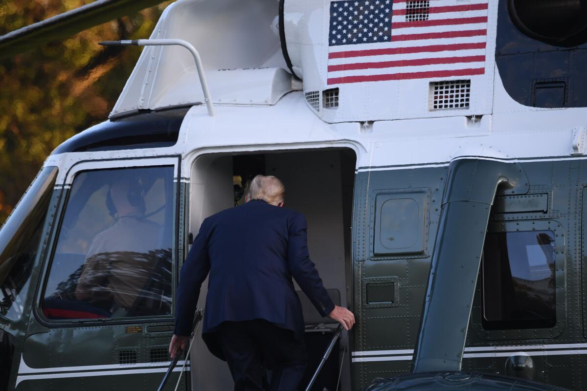Trump boards Marine One en route to Walter Reed.