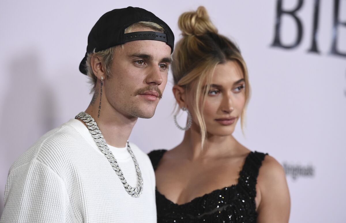 Justin Bieber and Hailey Baldwin arrive at the Los Angeles premiere of "Justin Bieber: Seasons," Monday, Jan. 27, 2020. 