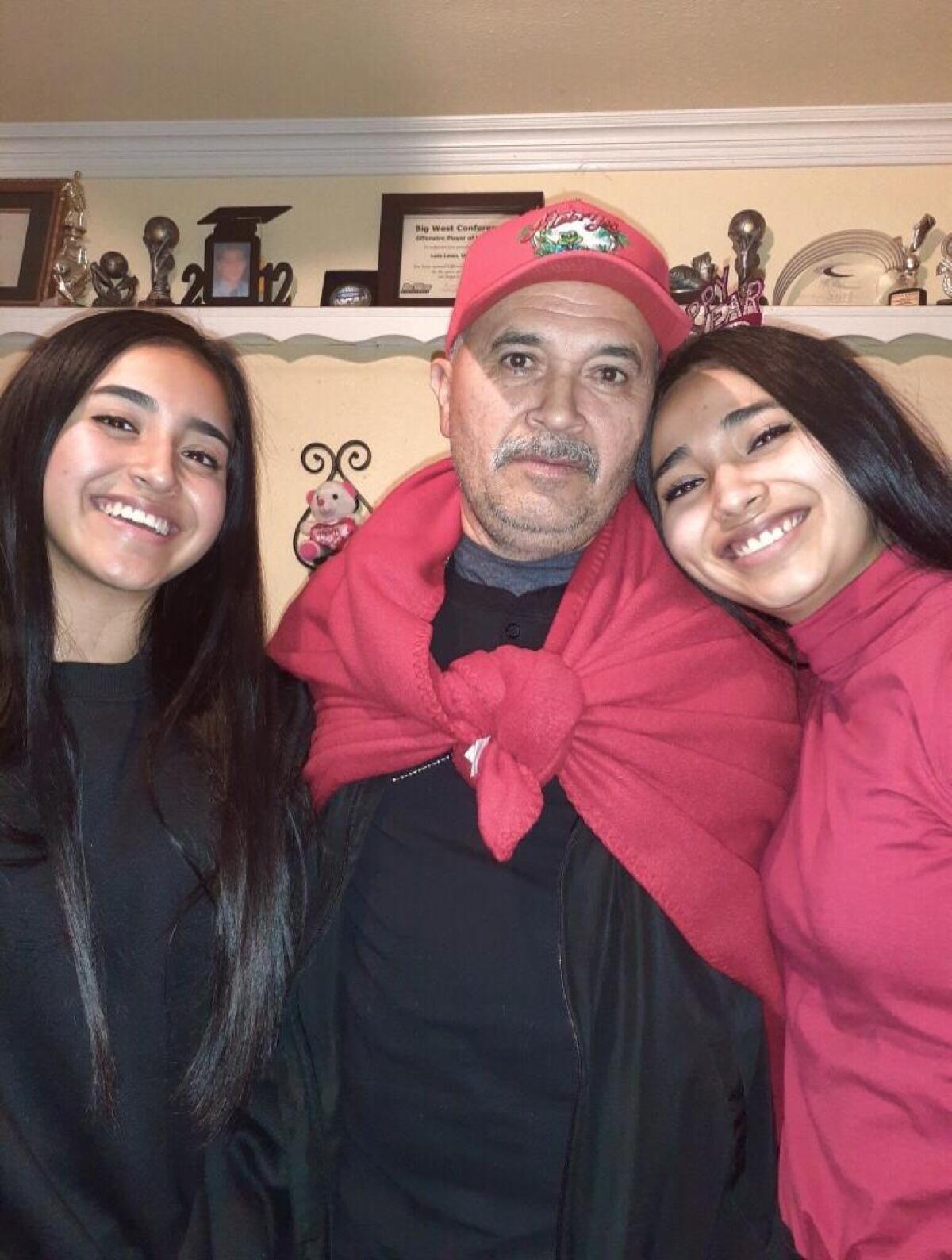 Héctor Echegoyén with two of his daughters, Laisha, left and the Harvard-bound Cielo, right.