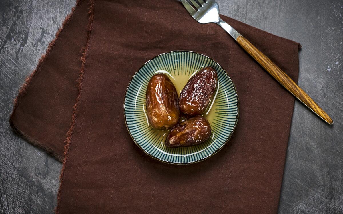 Honey and acidic natural wine play up the complex sweetness of dates in this boozy snack.