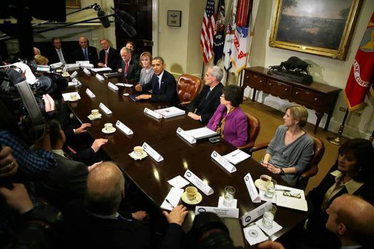 President Obama meets with health insurance executives in the Roosevelt Room at the White House.