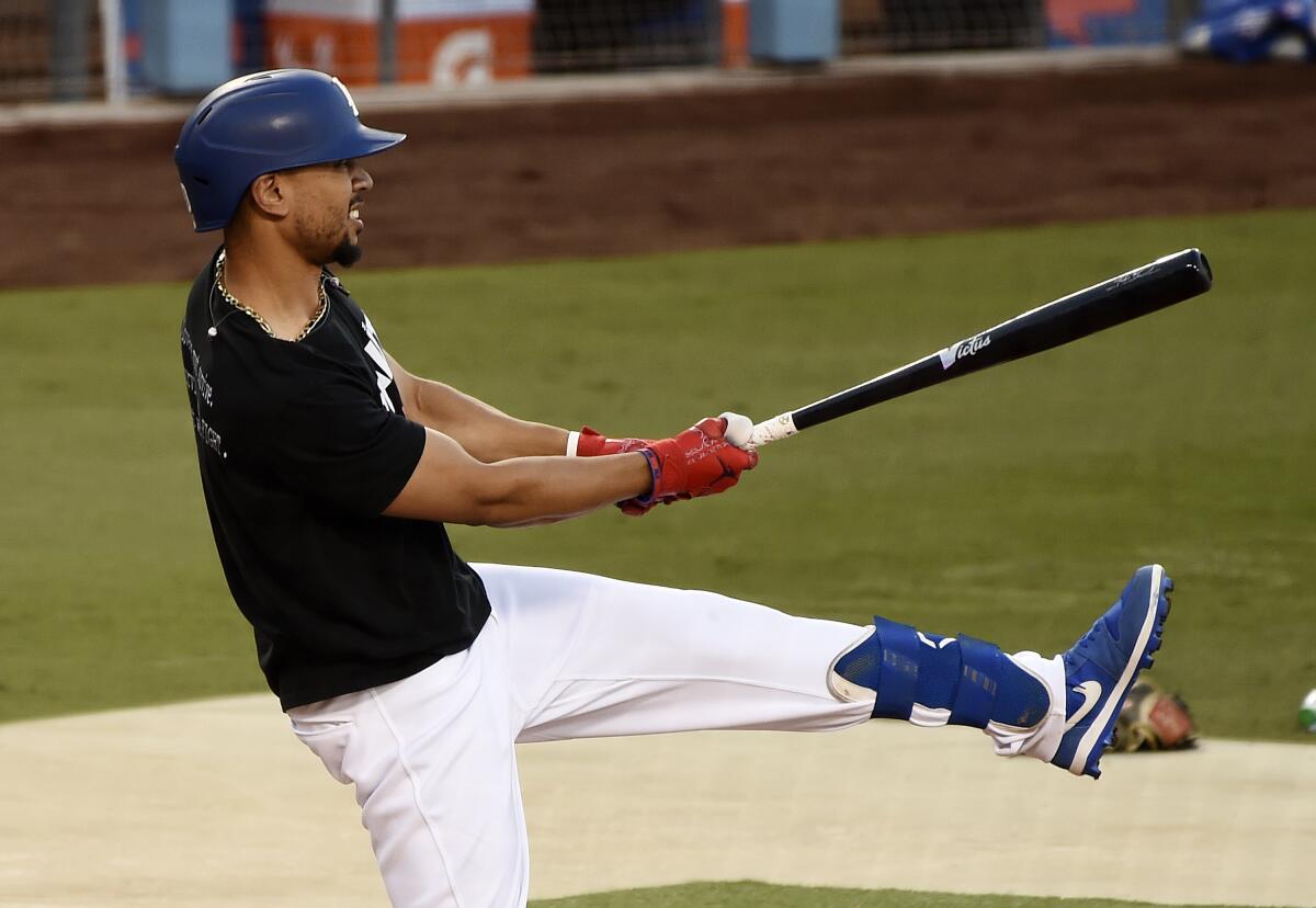 Dodgers right fielder Mookie Betts takes part in a team practice session on Tuesday.