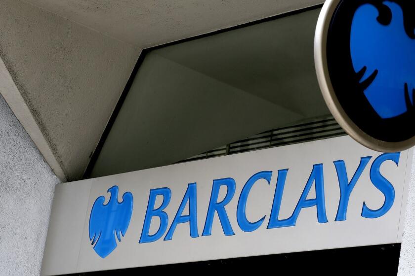 FILE - This July 29, 2015, file photo shows the sign on a branch of Barclays Bank in London. Barclays has agreed to pay $2 billion in civil penalties to the U.S. government to settle a lawsuit alleging that it was involved in a fraudulent scheme to sell residential mortgage-backed securities. The announcement was made Thursday, March 29, 2018, by the U.S. attorney's office in Brooklyn. (AP Photo/Kirsty Wigglesworth, File)