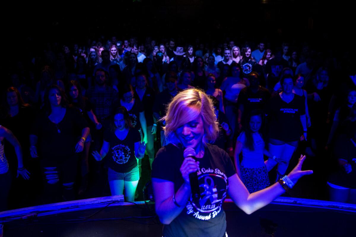 Borderline Bar and Grill dance instructor Kristal Lynn Konzen teaches some moves to the crowd at The Canyon bar.