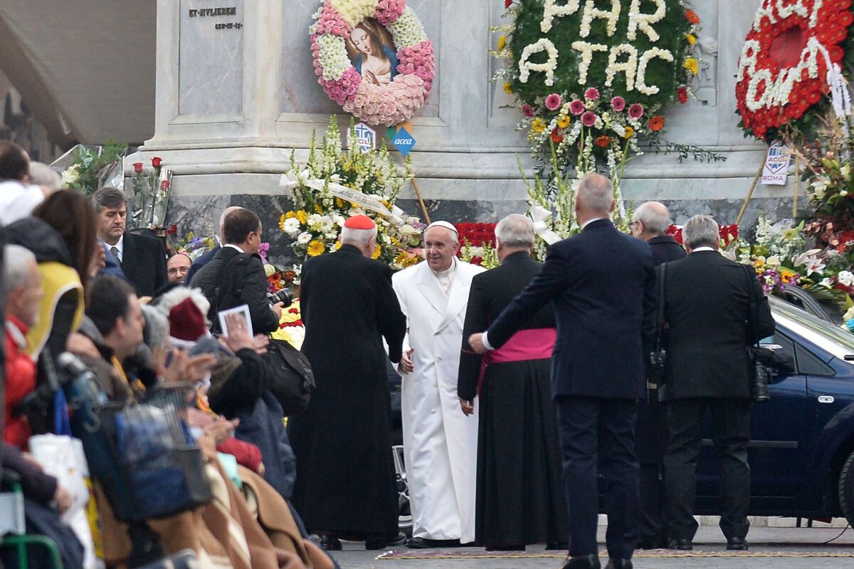 Pope Francis leaves after a prayer at the statue of the Virgin Mary during the annual feast of the Immaculate Conception at the Spanish Steps in Rome.