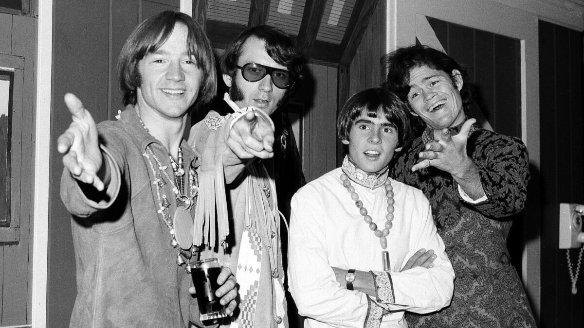 Monkees Peter Tork, left, Mike Nesmith, David Jones and Micky Dolenz at a 1967 news conference in New York.