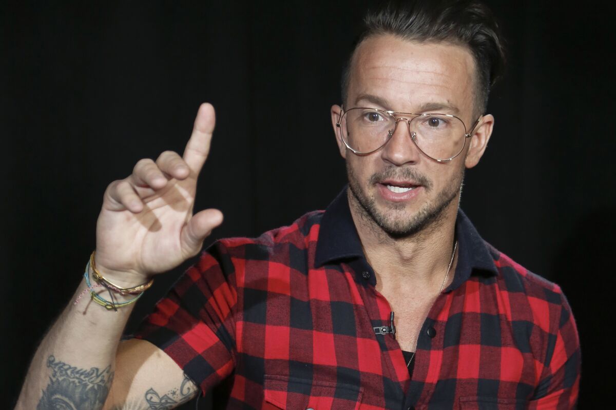 FILE - Carl Lentz speaks during an interview in New York on Oct. 23, 2017. Lentz, the ousted pastor of Hillsong New York City, has landed on staff at Transformation Church, a predominantly Black, nondenominational megachurch in Tulsa, Okla., that is led by pastor, author and popular YouTuber Michael Todd, the church said in March 27, 2023. (AP Photo/Bebeto Matthews, File)
