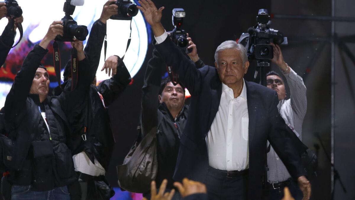 Andres Manuel Lopez Obrador waves to supporters as he arrives to Mexico City's main square, the Zocalo, on July 1, 2018.