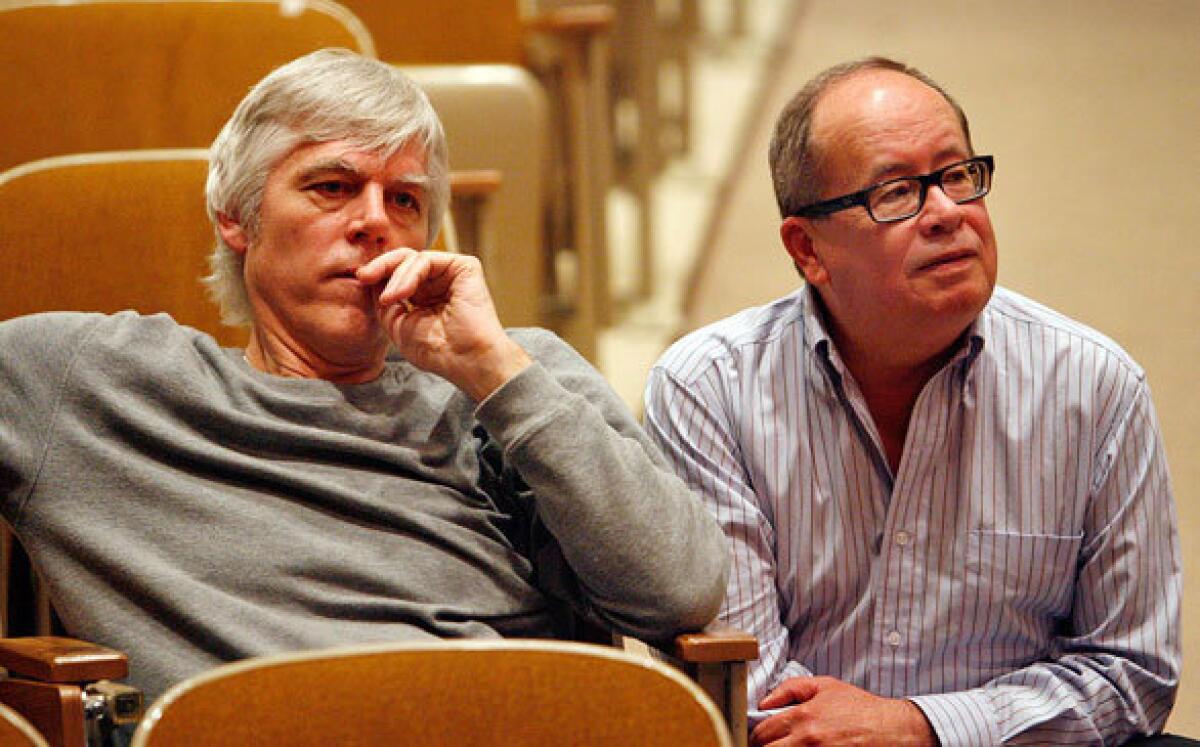 Friends Kenneth Wells, left, and Rickard Roudebush, shown observing a rehearsal, have shared a love of opera since they were schoolmates at Culver City Junior High. A chamber opera by Wells, a psychiatrist, premieres Friday at UCLA. Roudebush helped in its creation and has a role in the production.
