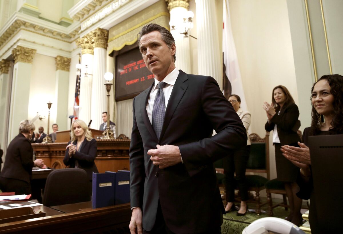 California Gov. Gavin Newsom receives applause after delivering his first State of the State address to a joint session of the Legislature at the Capitol in Sacramento.