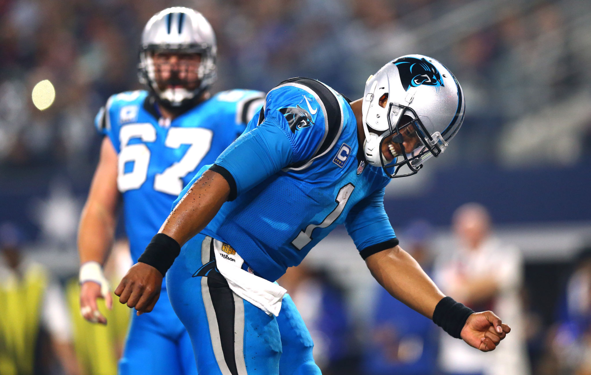 Carolina Panthers quarterback Cam Newton celebrates in front of center Ryan Kalil after scoring a touchdown.