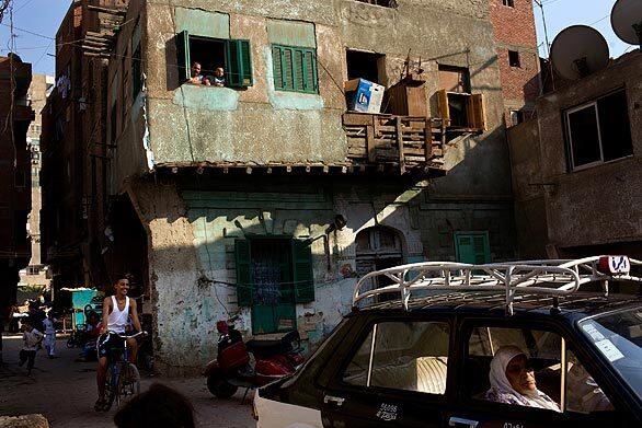 The square in Cairo's Tora neighborhood comes alive in the late afternoon, after the heat of the summer day has dissipated. Most residents live in the same homes their parents grew up in.